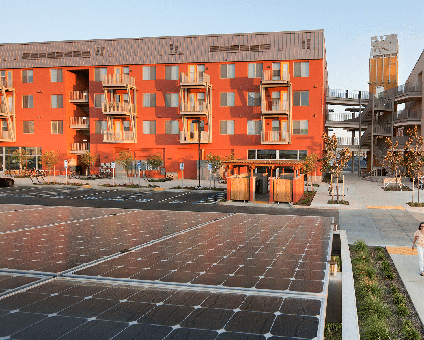 UC Davis West Village is the largest “zero net energy" (ZNE) community in the U.S.A., generating as much energy as it consumes. West Village, on the University of California Davis campus, is a mixed-use neighborhood of student and faculty housing with recreational facilities. West Village uses green conservation building practices and renewable energy generation techniques, such as solar panels, along with moveable sunscreens and bioswales to capture rainwater.